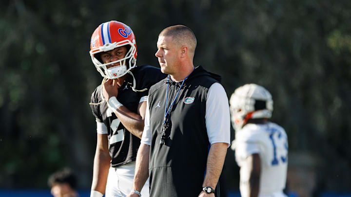 Florida Gators quarterback DJ Lagway (2) and Florida Gators head coach Billy Napier watch during spring football practice at Heavener Football Complex at the University of Florida in Gainesville, FL on Thursday, March 6, 2025. [Matt Pendleton/Gainesville Sun]