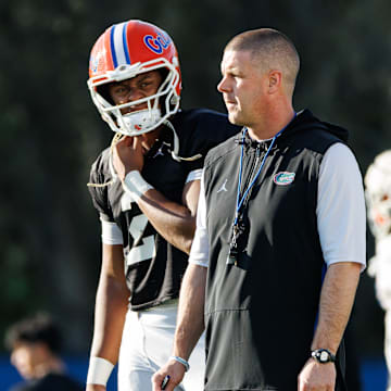 Florida Gators quarterback DJ Lagway (2) and Florida Gators head coach Billy Napier watch during spring football practice at Heavener Football Complex at the University of Florida in Gainesville, FL on Thursday, March 6, 2025. [Matt Pendleton/Gainesville Sun]