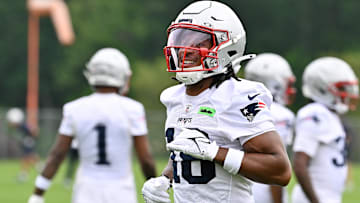 Jun 9, 2025; Foxborough, MA, USA; New England Patriots wide receiver Kyle Williams (18) reacts after completing a drill during minicamp at Gillette Stadium. Mandatory Credit: Eric Canha-Imagn Images
