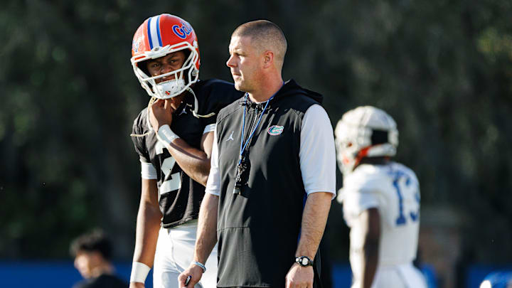 Florida Gators quarterback DJ Lagway (2) and Florida Gators head coach Billy Napier watch during spring football practice at Heavener Football Complex at the University of Florida in Gainesville, FL on Thursday, March 6, 2025. [Matt Pendleton/Gainesville Sun]