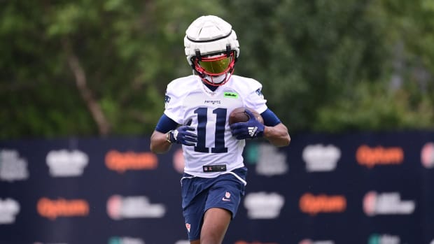 New England Patriots wide receiver Tyquan Thornton (11) runs after making a catch during training camp at Gillette.