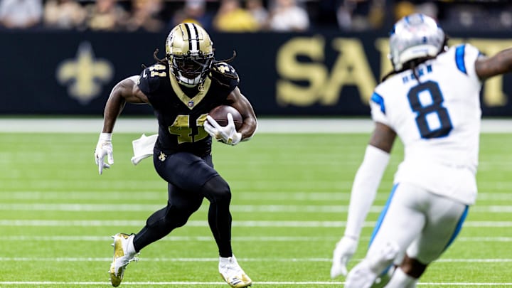 Sep 8, 2024; New Orleans, Louisiana, USA; New Orleans Saints running back Alvin Kamara (41) runs against Carolina Panthers cornerback Jaycee Horn (8) during the first half at Caesars Superdome. Mandatory Credit: Stephen Lew-Imagn Images Sep 8, 2024; New Orleans, Louisiana, USA; New Orleans Saints running back Alvin Kamara (41) runs against Carolina Panthers cornerback Jaycee Horn (8) during the first half at Caesars Superdome. Mandatory Credit: Stephen Lew-Imagn Images