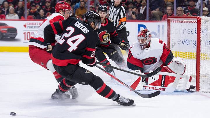Apr 5, 2026; Ottawa, Ontario, CAN; Ottawa Senators center Dylan Cozens (24) is taken off the puck by Carolina Hurricanes right wing Andrei Svechnikov (37) in the first period at the Canadian Tire Centre. Mandatory Credit: Marc DesRosiers-IMAGN Images