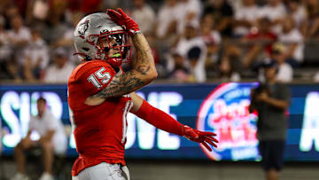 Aug 31, 2024; Tucson, Arizona, USA; New Mexico wide receiver Luke Wysong (15) celebrates touchdown during first quarter at Arizona Stadium. Mandatory Credit: Aryanna Frank-Imagn Images
