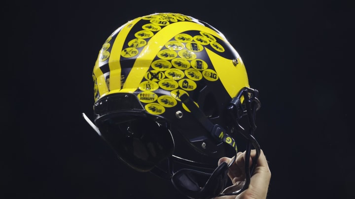 Dec 3, 2022; Indianapolis, Indiana, USA; A Michigan Wolverines player holds their helmet following their 43-22 victory against Purdue in the Big Ten Championship at Lucas Oil Stadium. Mandatory Credit: Trevor Ruszkowski-USA TODAY Sports