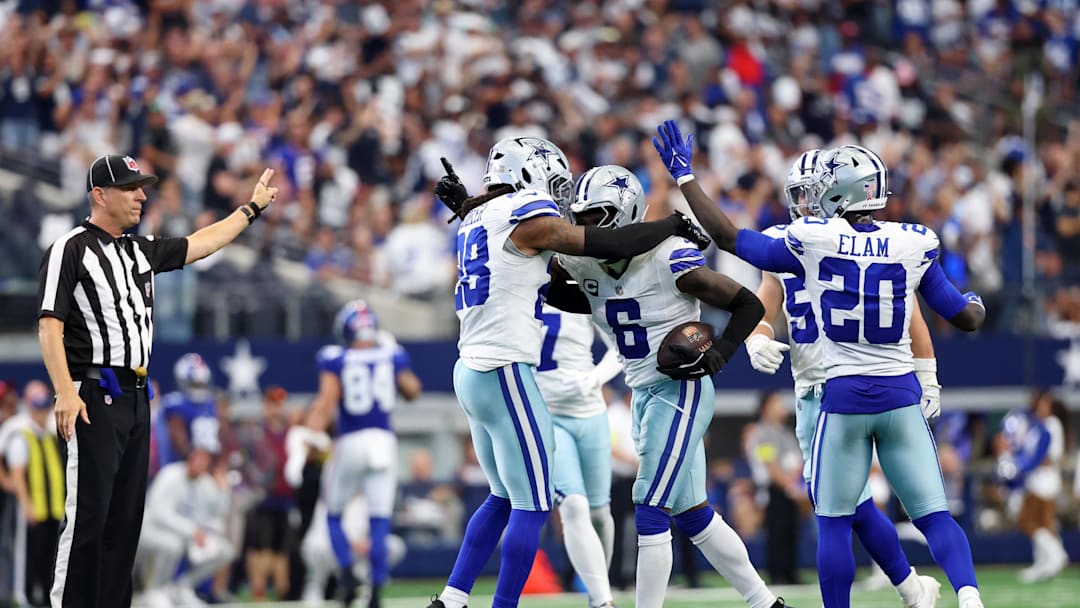 Sep 14, 2025; Arlington, Texas, USA; Dallas Cowboys safety Donovan Wilson (6) celebrates with safety Malik Hooker (28) after making an interception against the New York Giants during overtime at AT&T Stadium. Mandatory Credit: Kevin Jairaj-Imagn Images