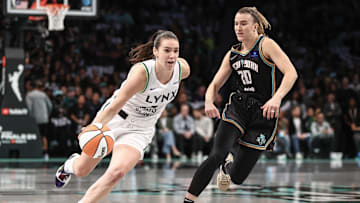 Minnesota Lynx forward Bridget Carleton (6) drives past New York Liberty guard Sabrina Ionescu (20)