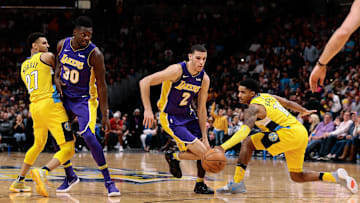 Dec 2, 2017; Denver, CO, USA; Los Angeles Lakers forward Julius Randle (30) defends against Denver Nuggets guard Jamal Murray (27) as guard Lonzo Ball (2) dribbles the ball under pressure from guard Gary Harris (14) in the fourth quarter at the Pepsi Center. Mandatory Credit: Isaiah J. Downing-Imagn Images