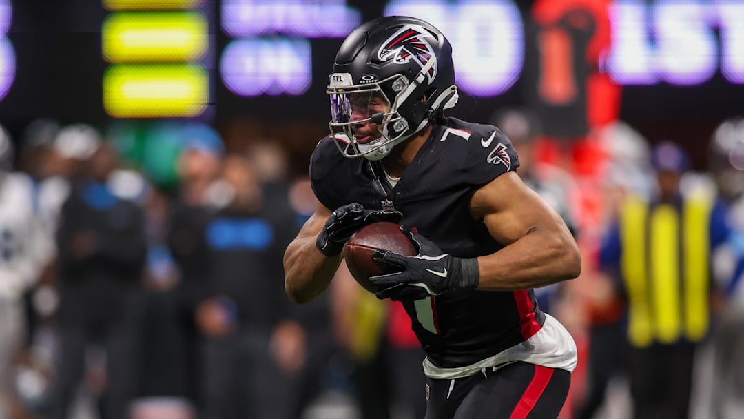 Jan 5, 2025; Atlanta, Georgia, USA; Atlanta Falcons running back Bijan Robinson (7) runs the ball against the Carolina Panthers in the second quarter at Mercedes-Benz Stadium. Mandatory Credit: Brett Davis-Imagn Images
