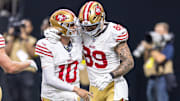Sep 14, 2025; New Orleans, Louisiana, USA;  San Francisco 49ers quarterback Mac Jones (10) celebrate a touchdown pass to tight end Luke Farrell (89) against the New Orleans Saints during the first half at Caesars Superdome. Mandatory Credit: Stephen Lew-Imagn Images