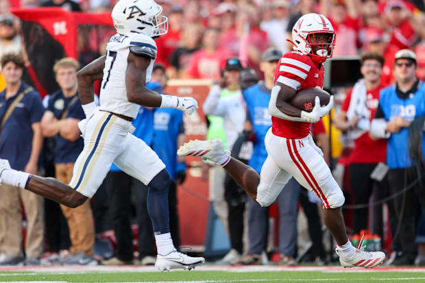 Nebraska running back Emmett Johnson scores on a 47-yard run against Akron.