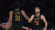Apr 28, 2025; Miami, Florida, USA; Cleveland Cavaliers forward Dean Wade (32) shakes hands with center Jarrett Allen (31) in the second quarter during game four for the first round of the 2025 NBA Playoffs against the Miami Heat at Kaseya Center. Mandatory Credit: Sam Navarro-Imagn Images
