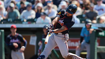 Feb 28, 2025; Jupiter, Florida, USA; Atlanta Braves designated hitter Drake Baldwin (75) hits an RBI single against the Miami Marlins during the third inning at Roger Dean Chevrolet Stadium. Mandatory Credit: Sam Navarro-Imagn Images