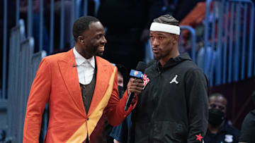 February 20, 2022; Cleveland, Ohio, USA; Team Durant forward Draymond Green of the Golden State Warriors (23, left) interviews Team LeBron forward Jimmy Butler of the Miami Heat (22) during the fourth quarter in the 2022 NBA All-Star Game at Rocket Mortgage FieldHouse. Mandatory Credit: Kyle Terada-Imagn Images