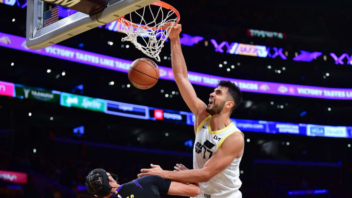 Nov 21, 2023; Los Angeles, California, USA; Utah Jazz center Omer Yurtseven (77) dunks for the basket against Los Angeles Lakers center Jaxson Hayes (11) during the second half at Crypto.com Arena. Mandatory Credit: Gary A. Vasquez-USA TODAY Sports