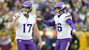 Nov 23, 2025; Green Bay, Wisconsin, USA; Minnesota Vikings place kicker Will Reichard (16) reacts with punter Ryan Wright (17) after kicking a field goal against the Green Bay Packers during the first half at Lambeau Field.