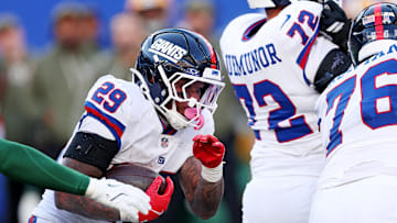 Nov 16, 2025; East Rutherford, New Jersey, USA; New York Giants running back Tyrone Tracy Jr. (29) runs the ball during the fourth quarter against the New York Giants at MetLife Stadium. Mandatory Credit: Vincent Carchietta-Imagn Images