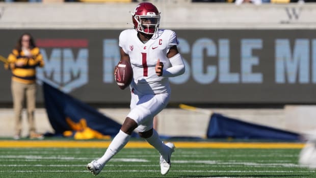 Washington State Cougars quarterback Cameron Ward (1) rolls out against the California Golden Bears