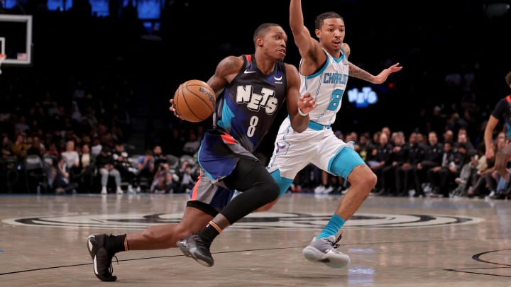 Nov 30, 2023; Brooklyn, New York, USA; Brooklyn Nets guard Lonnie Walker IV (8) drives to the basket against Charlotte Hornets guard Nick Smith Jr. (8) during the second quarter at Barclays Center. Mandatory Credit: Brad Penner-USA TODAY Sports