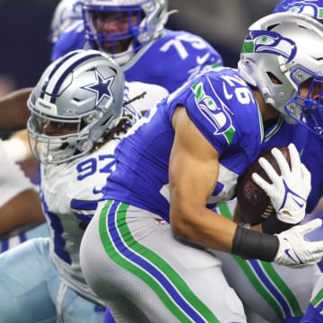 Nov 30, 2023; Arlington, Texas, USA; Seattle Seahawks running back Zach Charbonnet (26) runs the ball against the Dallas Cowboys during the first half at AT&T Stadium. Mandatory Credit: Tim Heitman-USA TODAY Sports