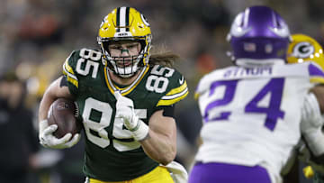 Jan 1, 2023; Green Bay, Wisconsin, USA; Green Bay Packers tight end Robert Tonyan (85) runs for a first down on a reception against the Minnesota Vikings in the fourth quarter of their game at Lambeau Field.