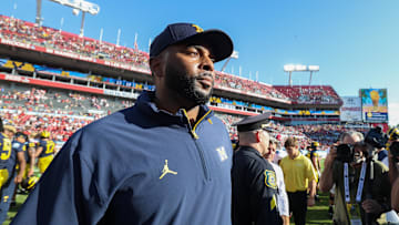 Dec 31, 2024; Tampa, FL, USA; Michigan Wolverines head coach Sherrone Moore celebrates after beating the Alabama Crimson Tide in the ReliaQuest Bowl at Raymond James Stadium. Mandatory Credit: Nathan Ray Seebeck-Imagn Images