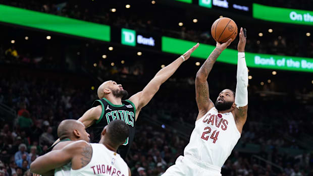 Cleveland Cavaliers forward Marcus Morris Sr. (24) shoots against Boston Celtics guard Derrick White (9).