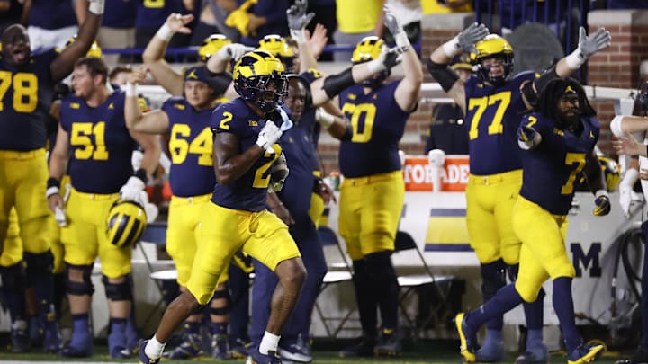 Aug 31, 2024; Ann Arbor, Michigan, USA;  Michigan Wolverines defensive back Will Johnson (2) runs the ball after he makes an interception in the second half against the Fresno State Bulldogs at Michigan Stadium. Mandatory Credit: Rick Osentoski-Imagn Images