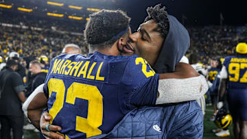 Michigan running back Jordan Marshall (23) hugs running back Justice Haynes (22) after a 21-16 win over Purdue at Michigan Stadium in Ann Arbor on Saturday, November 1, 2025.