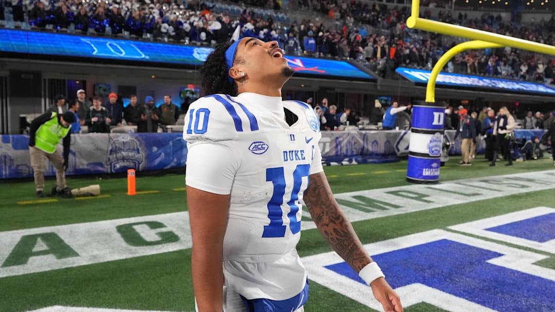 Dec 6, 2025; Charlotte, NC, USA; Duke Blue Devils quarterback Darian Mensah (10) reacts after winning the  ACC Championship game at Bank of America Stadium. Mandatory Credit: Bob Donnan-Imagn Images
