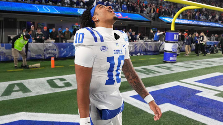 Dec 6, 2025; Charlotte, NC, USA; Duke Blue Devils quarterback Darian Mensah (10) reacts after winning the  ACC Championship game at Bank of America Stadium. 