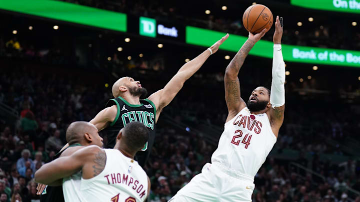 May 15, 2024; Boston, Massachusetts, USA; Cleveland Cavaliers forward Marcus Morris Sr. (24) shoots against Boston Celtics guard Derrick White (9) in the second quarter during game five of the second round for the 2024 NBA playoffs at TD Garden. Mandatory Credit: David Butler II-Imagn Images