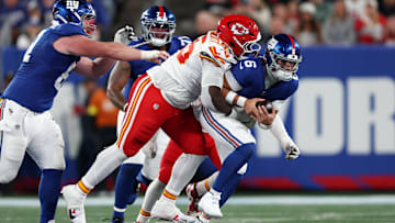 Sep 21, 2025; East Rutherford, New Jersey, USA; Kansas City Chiefs defensive tackle Omarr Norman-Lott (55) tackles New York Giants quarterback Jaxson Dart (6) in the third quarter at MetLife Stadium. Mandatory Credit: Vincent Carchietta-Imagn Images