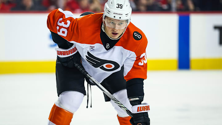Dec 31, 2025; Calgary, Alberta, CAN; Philadelphia Flyers right wing Matvei Michkov (39) during the face off against the Calgary Flames during the first period at Scotiabank Saddledome. Mandatory Credit: Sergei Belski-Imagn Images