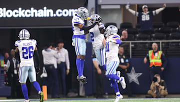 Dec 22, 2024; Arlington, Texas, USA; Dallas Cowboys cornerback Jourdan Lewis (2) celebrates after making an interception in the fourth quarter against the Tampa Bay Buccaneers at AT&T Stadium. Mandatory Credit: Tim Heitman-Imagn Images