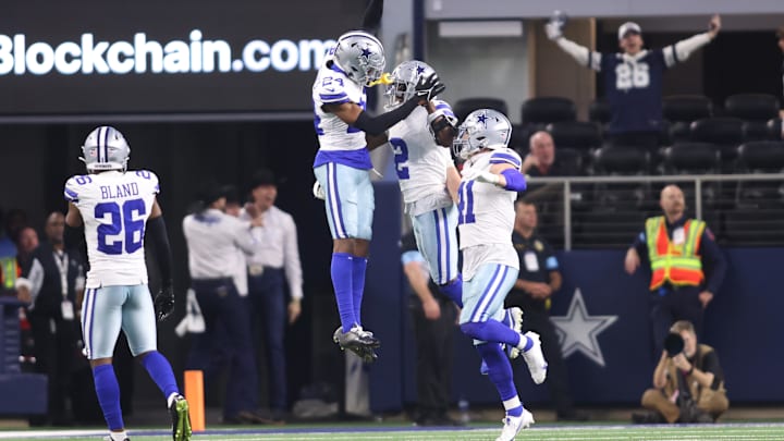 Dec 22, 2024; Arlington, Texas, USA; Dallas Cowboys cornerback Jourdan Lewis (2) celebrates after making an interception in the fourth quarter against the Tampa Bay Buccaneers at AT&T Stadium. Mandatory Credit: Tim Heitman-Imagn Images