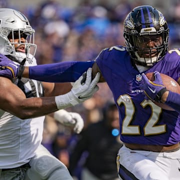 Baltimore Ravens running back Derrick Henry (22) stiff arms Las Vegas Raiders defensive tackle Christian Wilkins (94) during the second half at M&T Bank Stadium. 