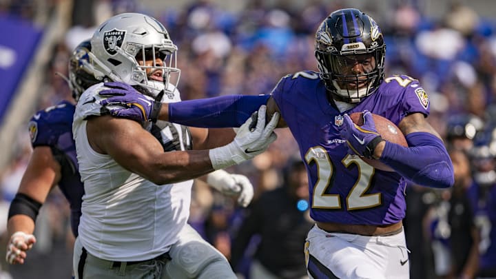 Baltimore Ravens running back Derrick Henry (22) stiff arms Las Vegas Raiders defensive tackle Christian Wilkins (94) during the second half at M&T Bank Stadium. 