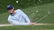 Adam Schenk hits out of a bunker on no. 2 during a practice round of the Masters Tournament 
