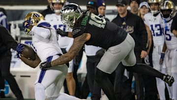 Oregon outside linebacker Matayo Uiagalelei brings down Washington running back Jonah Coleman as the No. 1 Oregon Ducks host the Washington Huskies Saturday, Nov. 30, 2024 at Autzen Stadium in Eugene, Ore.