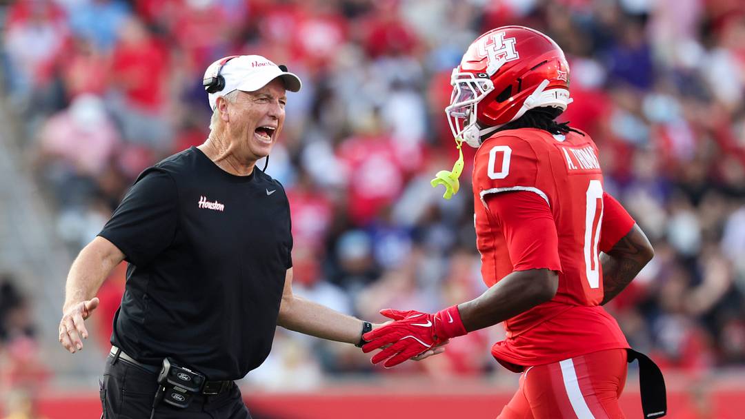 Nov 22, 2025; Houston, Texas, USA; Houston Cougars head coach Willie Fritz celebrates with wide receiver Amare Thomas (0) after Thomas scores a touchdown during the second quarter against the TCU Horned Frogs at TDECU Stadium. Mandatory Credit: Troy Taormina-Imagn Images Nov 22, 2025; Houston, Texas, USA; Houston Cougars head coach Willie Fritz celebrates with wide receiver Amare Thomas (0) after Thomas scores a touchdown during the second quarter against the TCU Horned Frogs at TDECU Stadium. Mandatory Credit: Troy Taormina-Imagn Images