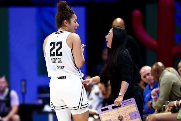 Golden State Valkyries guard Veronica Burton (22) laughs with head coach Natalie Nakase. 