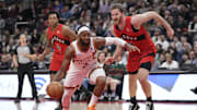 Nov 29, 2023; Toronto, Ontario, CAN; Phoenix Suns forward Josh Okogie (2) drives to the basket against Toronto Raptors center Jakob Poeltl (19) during the first half at Scotiabank Arena. Mandatory Credit: John E. Sokolowski-Imagn Images