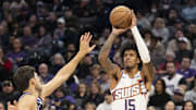 November 13, 2024; Sacramento, California, USA; Phoenix Suns forward Jalen Bridges (15) shoots the basketball against Sacramento Kings forward Doug McDermott (7) during the fourth quarter at Golden 1 Center. Mandatory Credit: Kyle Terada-Imagn Images
