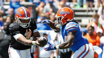 Apr 12, 2025; Gainesville, FL, USA; Florida Gators quarterback DJ Lagway (2) hands the ball to Florida Gators running back Ja'Kobi Jackson (24) during the first half at Ben Hill Griffin Stadium. Mandatory Credit: Matt Pendleton-Imagn Images