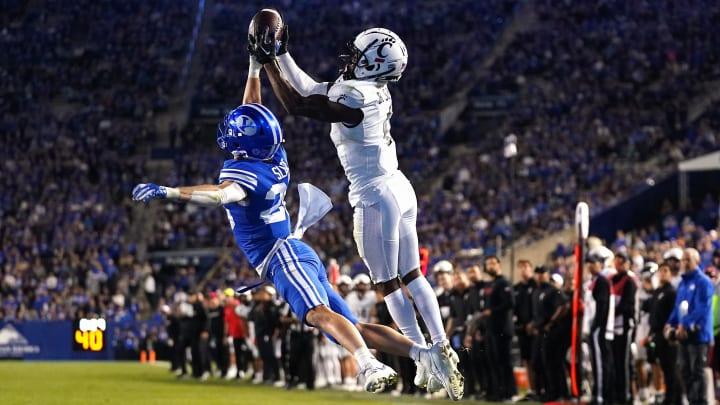 Cincinnati Bearcats linebacker Dorian Jones (6) catches a touchdown pass as Brigham Young Cougars safety Ethan Slade (26) defends in the fourth quarter during a college football game between the Brigham Young Cougars and the Cincinnati Bearcats, Saturday, Sept. 30, 2023, at LaVell Edwards Stadium in Provo, Utah.