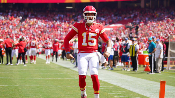 Aug 17, 2024; Kansas City, Missouri, USA; Kansas City Chiefs quarterback Patrick Mahomes (15) celebrates toward fans against the Detroit Lions prior to a game at GEHA Field at Arrowhead Stadium. Mandatory Credit: Denny Medley-USA TODAY Sports