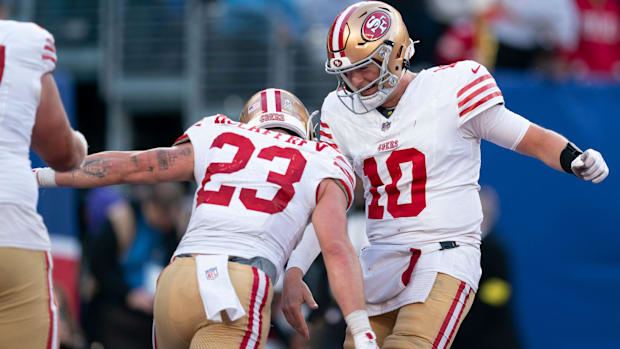 San Francisco 49ers quarterback Mac Jones and running back Christian McCaffrey