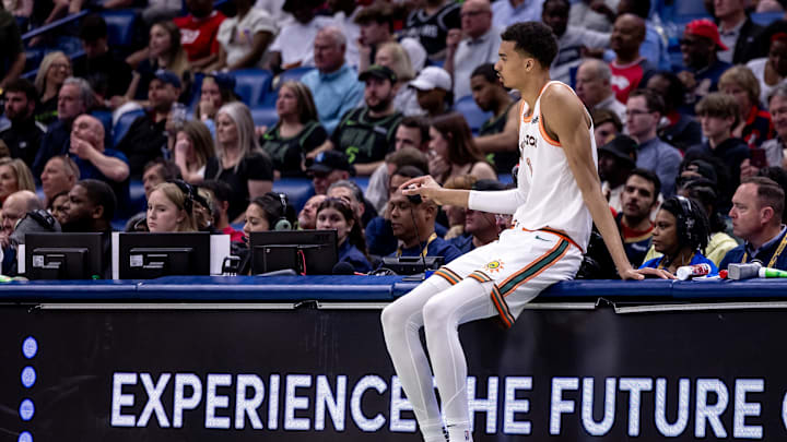 Apr 5, 2024; New Orleans, Louisiana, USA; San Antonio Spurs center Victor Wembanyama (1) plays with the referee mic screen before he goes in against the New Orleans Pelicans during the second half at Smoothie King Center.