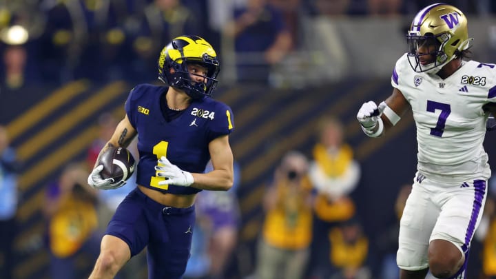 Jan 8, 2024; Houston, TX, USA; Michigan Wolverines wide receiver Roman Wilson (1) runs with the ball against the Washington Huskies during the first quarter in the 2024 College Football Playoff national championship game at NRG Stadium. Mandatory Credit: Mark J. Rebilas-USA TODAY Sports